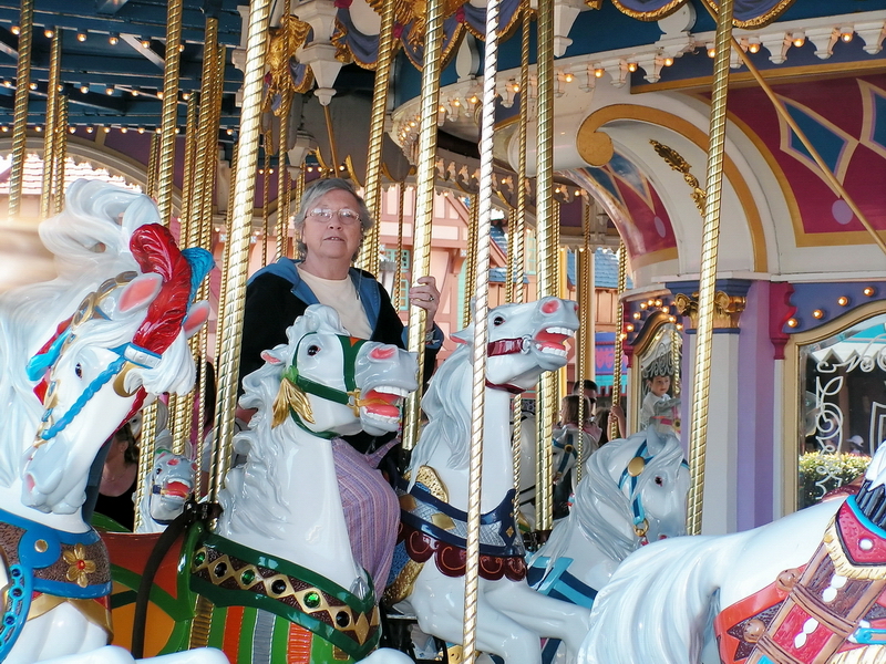 Joy riding the carrousel at Disney, Florida